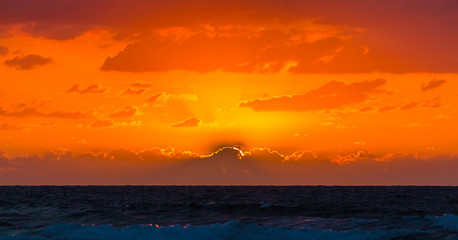 Wall Mural - sea waves on the sunset background