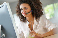 Portrait Of Customer Service Assistant Talking On Phone