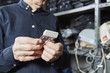 © Westend61 - Man holding motherboard connector