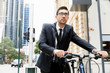© Sergey Nivens - Young businessmen with a bike