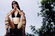 © Alexander - Woman in bikini, resting head on hands, legs apart