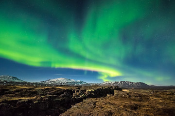 Wall Mural - aurora borealis over the thingvellir national park - iceland