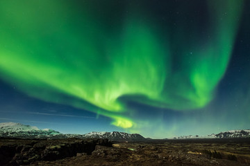 Wall Mural - aurora borealis over the thingvellir national park - iceland