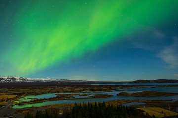 Wall Mural - aurora borealis over the thingvellir national park - iceland