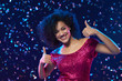 © paffy - Woman dancing on a party over colorful background with confetti