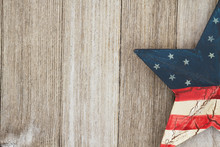 USA Patriotic Old Flag On A Star And Weathered Wood Background