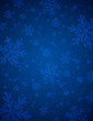 Blue  background with white blurred snowflakes, vector