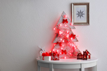 Poster - Decorated handmade Christmas tree on white table