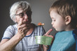 © progat - Grandmother feeding her grandson