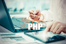 Technology And Internet Concept - Businessman Holds The Php Button On Virtual Screens