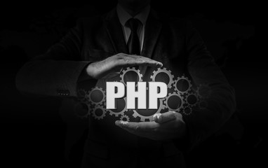 technology and internet concept - businessman holds the php button on virtual screens