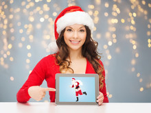 Woman With Santa Claus On Tablet Pc Screen