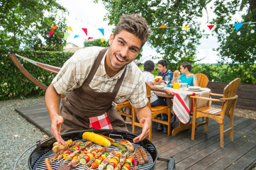 Friends happy during a barbecue at family garden BBQ