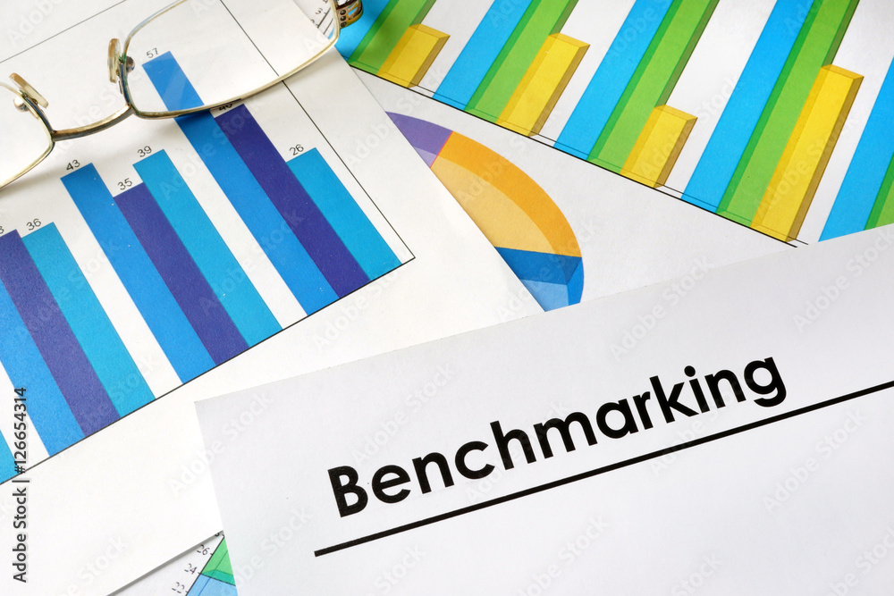 Paper with words Benchmarking and charts. Stock Photo | Adobe Stock