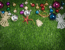 Christmas Ball And Decoration On Grass Background. 