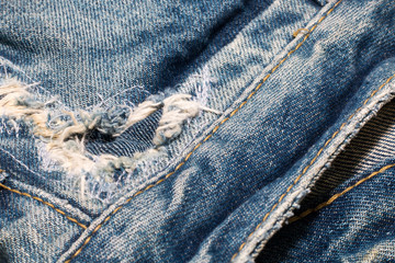 old jean on wooden desk table , part of jean,