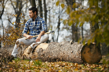 Wall Mural - Man with axe in the forest