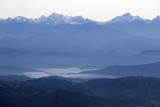 Fototapeta Natura - A view of the sun rising over the Himalayas from Dhulikhel, Nepal