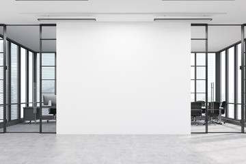 office lobby with a large white wall and two meeting rooms