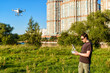 © scaliger - Man operating a drone quad copter