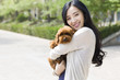© Blue Jean Images - Happy young woman with her pet dog