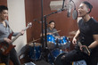 © Blue Jean Images - Musical band in recording studio