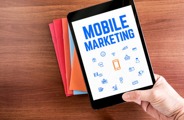 Aufkleber - Top view of hand holding tablet with Mobile marketing word with
