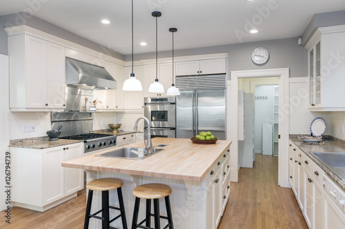 Cuadros en Lienzo Amazing Luxury Kitchen Interior in white with wooden floor and kitchen island