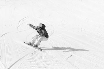 Wall Mural - Ssnowboarder on slopes in the sunny morning