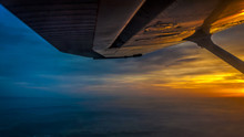 Sunset On Board Of A Cessna