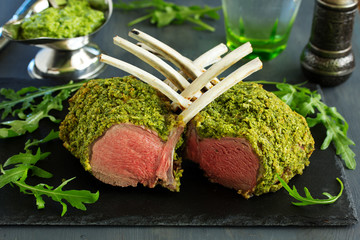 Canvas Print - Rack of lamb in herb cheese and breadcrumbs. A festive meal. Selective focus.