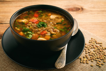 Wall Mural - Hot soup with green lentil, chicken, vegetables and spices.