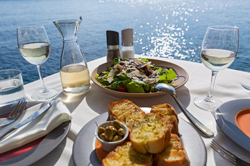 Wall Mural - Table with food and wine