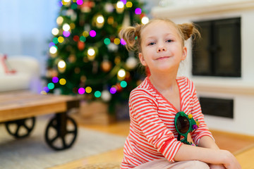 Canvas Print - Little girl at home decorated for Christmas