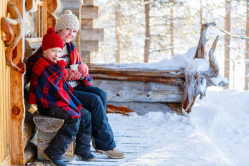 Canvas Print - Mother and daughter outdoors on winter