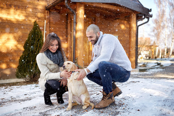 Winter holyday with dog on mountain