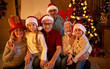 © luckybusiness - Happy family with gifts at xmas.