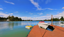 View Of Wooden Pier With Blue Lake Tapps ,sky Background