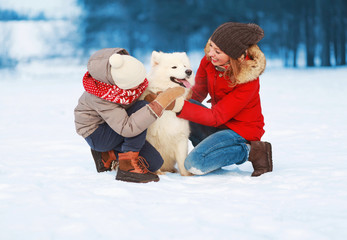 Wall Mural - Christmas happy smiling family, mother and son child walking wit