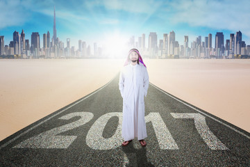 Wall Mural - Business muslim standing on street with 2017