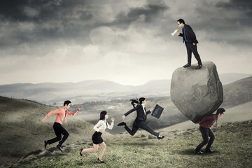 Wall Mural - Business people with hurdle on the hill