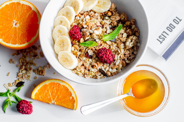 Breakfast with oatmeal and to do list on white background