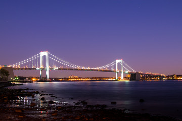 dusk over long island sound and throggs neck bridge in bronx new york