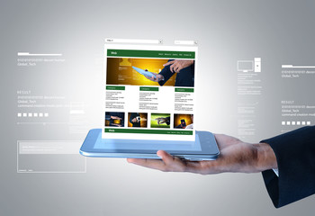 Wall Mural - business man showing web page on tablet computer