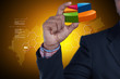 © cutimage - Business man showing pie chart in color background
