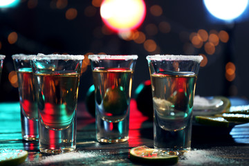 Canvas Print - Gold tequila shots with lime and salt in bar