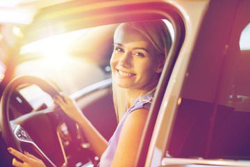 Poster - happy woman inside car in auto show or salon