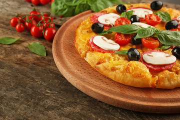 Poster - Delicious pizza with mushrooms, cherry tomatoes, olives and basil on wooden background