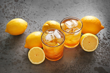 Canvas Print - Glasses of iced tea with lemon slices on gray background