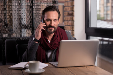 Wall Mural - Handsome self employed businessman speaking on the phone